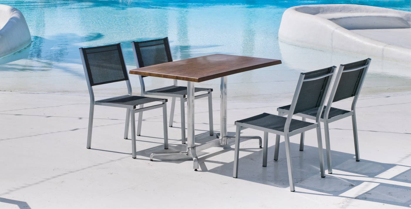 Conjunto aluminio: mesa rectangular 120 cm. con tablero de heverzaplus y 4 sillas de aluminio y textilen